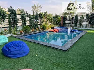 A detached villa with a swimming pool ultra super luxurious finishes 5 bedrooms prime location and best layout for sale in Hyde Park Compound
