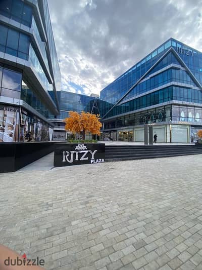 For sale: a fully finished, ultra-super-lux first-floor shop, currently rented, in Ritzy Mall, Sheikh Zayed City
