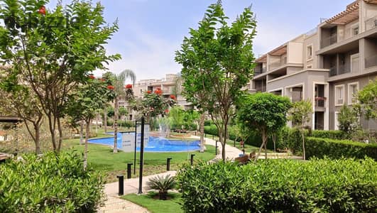 Ground floor apartment with garden for sale in October Plaza Sodic Compound, one of Sodic's most prestigious compounds