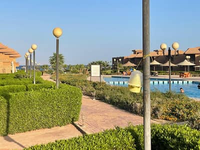Ground floor chalet with garden for sale in Malibu Village, Ain Sokhna, furnished