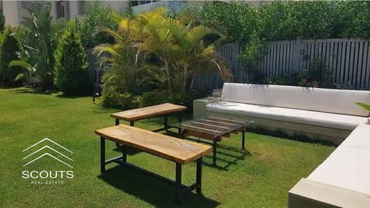 ready to move with installments apartment with garden for sale in New Cairo next to Swan Lake in Creek Town near Taj Sultan