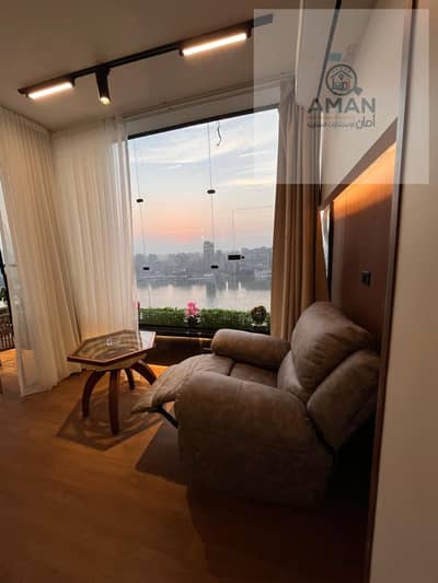 A luxurious apartment A, parallel to Abdul Aziz Al-Saud Street, with a Nile view from the balcony.