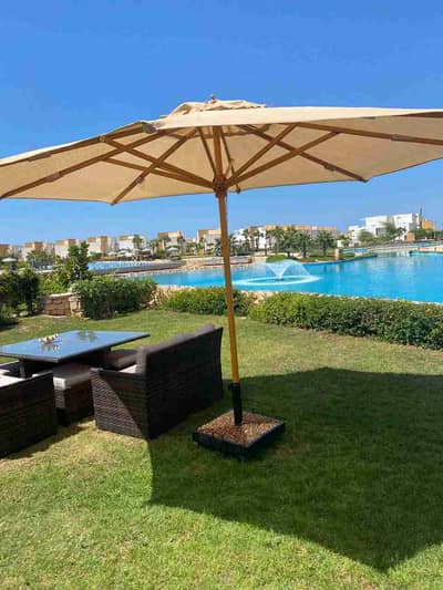 Hot Deal Standalone Villa for Sale in Seashell, North Coast, Sidi Abdel Rahman, just steps away from the beach, featuring a private garden and first-row lagoon view. Very prime location. / Seashell North Coast.