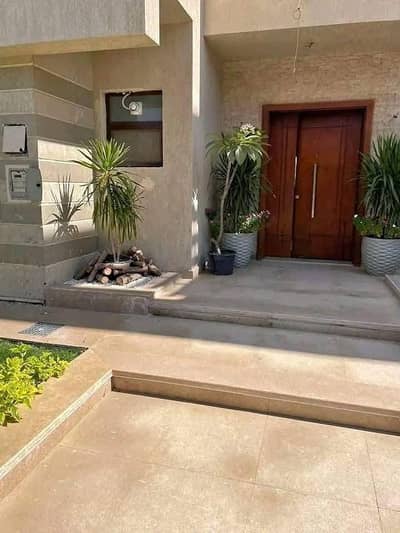 A villa with a garden is for sale, ready for viewing, with a view of the swimming pool and garden in a near Al Rehab City, with the longest i