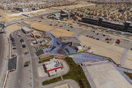 A commercial store with payment facilities on Sheikh Zayed axis with a down payment of only 10%