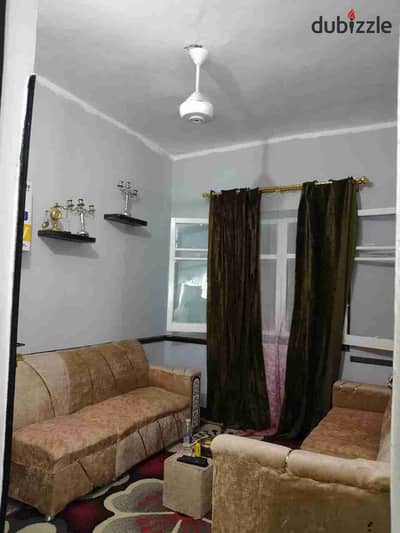 Furnished apartment in Maadi for rent, close to Maadi Metro and all services, transportation, and Freedom Square. Second floor, consisting of two bedrooms, a living room, a bathroom, and a kitchen.