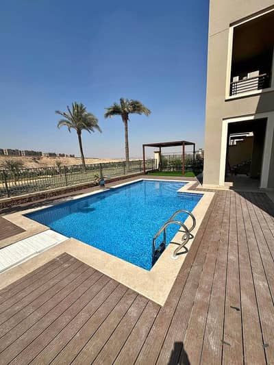 بموقع خيالي فيلا بحمام سباحة خاص متشطبة و مفروشة  للبيع في Uptown Cairo - القاهرة الجديدة