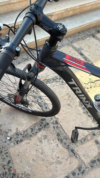 Trinix m100 لون احمر