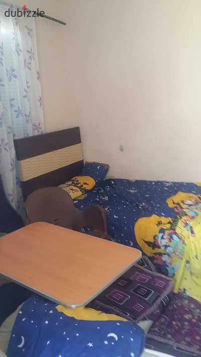 For sale in Al Shabab Al Shamali, First Settlement, a 70m² apartment on the top floor, bank-finished.