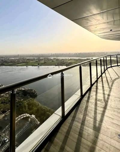 VIP apartment for sale, Nile front first row, high-end finishing, exclusive cash discount, in Reve Du Nil Tower, Maadi, minutes from Zamalek & Maadi.