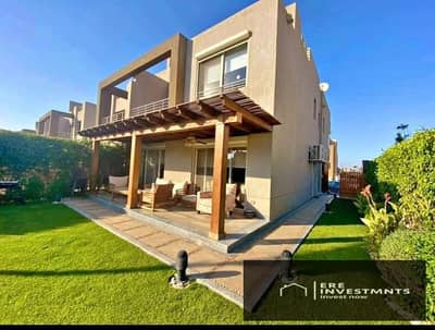 Corner townhouse for sale, ready for immediate occupancy, with a landscape view (installment payments remaining), in Palm Hills, New Cairo,