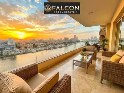 Apartment for sale with a direct Nile view, finished with air conditioning, furnished with appliances and kitchen, on the Maadi Corniche, minutes from