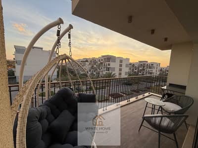 Furnished apartment for rent in Eastown Compound, ultra-modern, prime location, at the lowest price in the market.