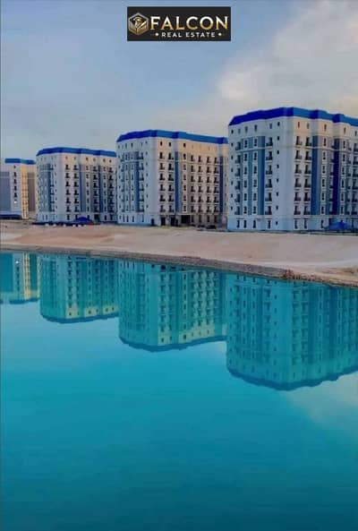 With 30% Discount Recieve immediately a Ready To move & Fully Finished 2BR facing North in Latin District with Lagoon & New Alamein Towers View