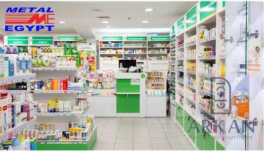 MM Pharmacy for sale, 76m², in a mall opposite Zewail University, with a 2 million down payment and installments over 5 years, and strong operational