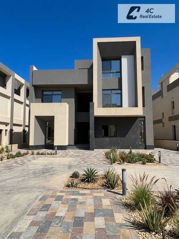 Twin house villa for resale in Saada New Cairo priced 4 million below market rate a 410 m area prime location and an open view