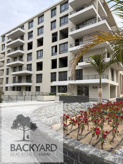 A fully finished apartment with a private garden at the old price in Palm Hills Compound, New Cairo