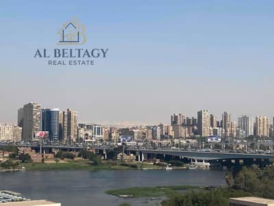 Furnished apartment for sale with an extra view of the Nile directly A Class prime location in Downtown on Al-Bahr Al-Azam street