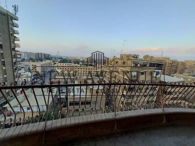 Apartment for sale in Nasr City behind Rabaa Mosque, 255 sqm, 7th floor, fully finished, 3 bedrooms, 2 baths, reception, 2 parking, prime location.
