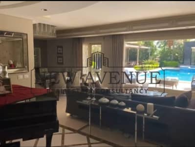 Standalone villa with pool first row golf in El Rabwa Sheikh Zayed fully finished semi furnished with a large garden