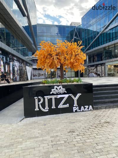 A fully finished and rented shop with annual returns in Ritzy Mall, Sheikh Zayed City, first floor, at a very special price.