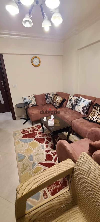 Fully furnished apartment for sale, super deluxe finishing, garden and street view, typical floor, ready to move in, 131 square meters, in Al Rehab 2