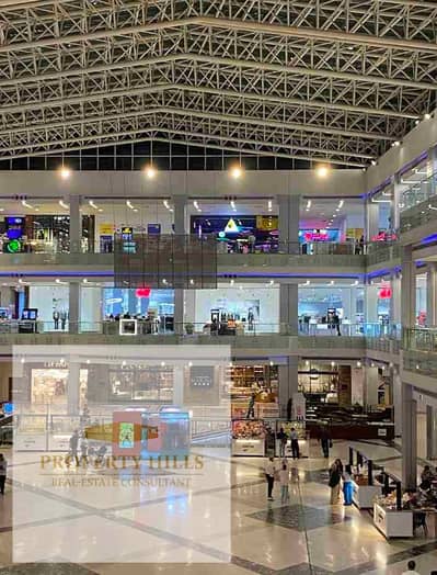 محل للبيع امام الجامعه الامريكيه بالتقسيط علي 7 سنين