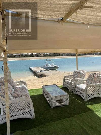 Villa for sale in Marina 2, first row on the sandy lagoon and second row from the sea, featuring a full panoramic view.