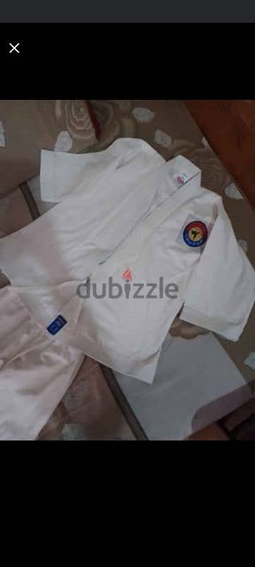بدله تايكوندو  قطن سن 11/12سنه طول البنطلون 75سنتي ب75ج