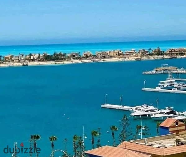 شالية للبيع متشطب بالكامل بفيو مميزعلي المارينا في مارينا 5  بالساحل الشمالي