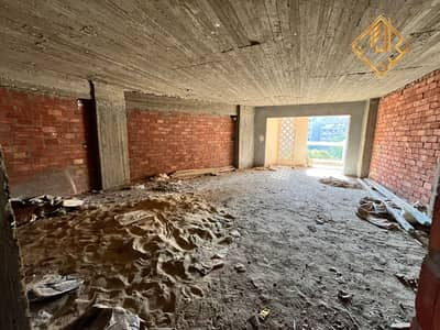 Apartment with a square view for sale in a modern tower in the Arab League and Batal Ahmed Abdel Aziz area.