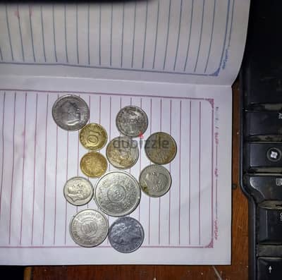 جموعة عملات معدنية قديمة متنوعة (عربية وأوروبية) لأعلى سعر.