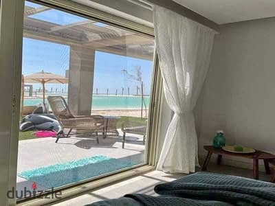 VIP chalet for sale in the most luxurious compound on the North Coast, Ras El Hikma (Seashore), fully finished in ultra super luxury with kitchen and