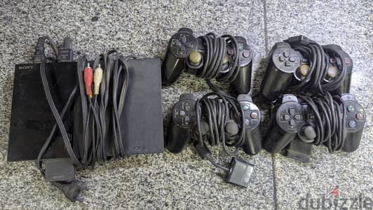 Playstation 2 with 4 Controllers & Games