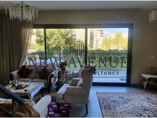 Town house corner for sale compound Al Burouj, Imkan misr, ready to move in, luxurious finishing with kitchen and AC's direct on landscape