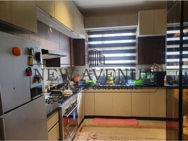 Town house corner for sale compound Al Burouj, Imkan misr, ready to move in, luxurious finishing with kitchen and AC's direct on landscape