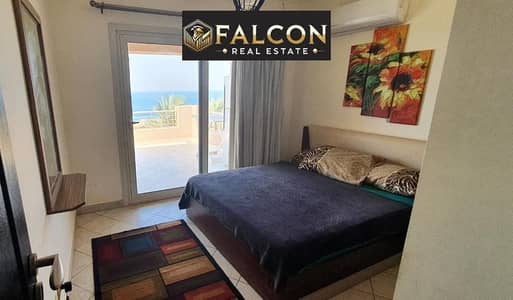 Hotel chalet for sale in Telal Ain Sokhna, fully finished with air conditioning and kitchen, first row on the sea