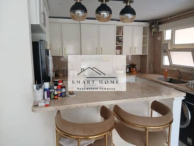 Ground floor apartment for sale, fully furnished, 153 sq m, in Al Khamael Compound, Sheikh Zayed.