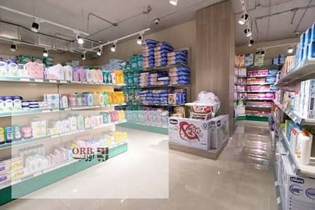 Pharmacy for sale in North Investors facing Garden 8 & Air Club. DP 1,738,800 EGP, installments 6 yrs. Delivery in 2 yrs, 2 mins from North 90 St. hot
