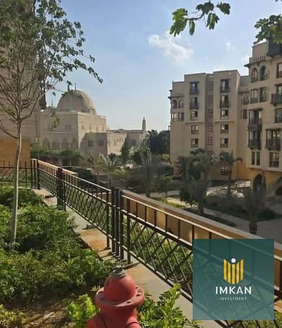 Ready-to-move-in apartment for sale in Fustat, Arabesque Compound, at a special price with a view of vast green spaces.