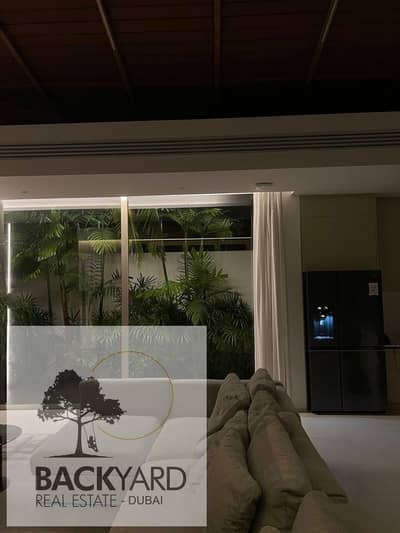 At the old price, an apartment with a private garden, fully finished, in Palm Hills Compound, New Cairo.