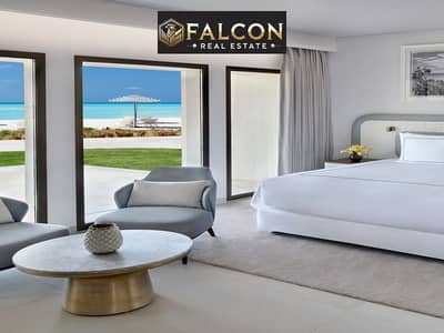 First row on the sea ready to move finished and hotel furnished directly next to Al Alamein Towers and Rixos Hotel For sale with installments
