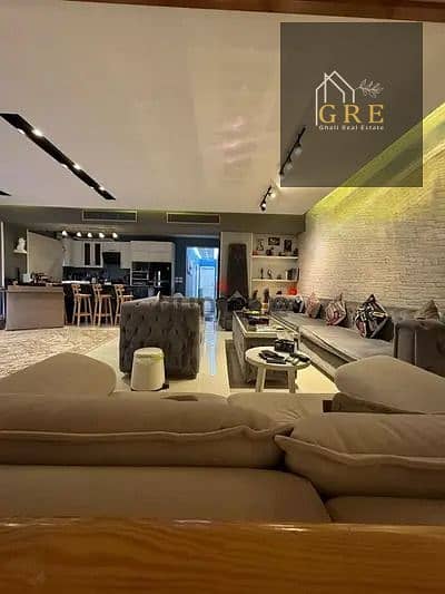 For sale apartment in Sheikh Zayed, Eighth District, 205m, first floor, luxurious hotel finishing, fully furnished, 3 air conditioners + central, view of green areas, prime location.