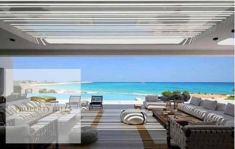 For sale in Ras Al-Hikma, a chalet with a private garden, hotel finishing, including air conditioning and kitchen