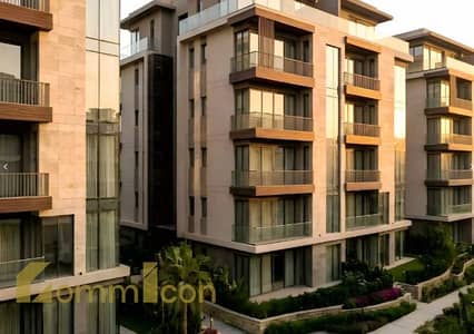 Apartment for sale with green views in the heart of R8 - UpMount compound near the iconic tower and the green river, the new administrative capital