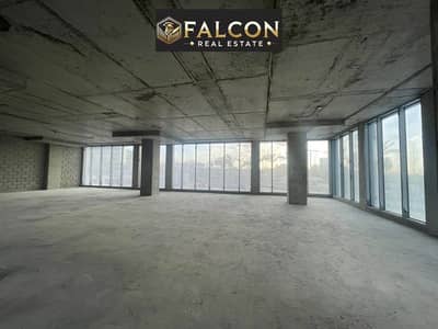 office glass façade amazing location-view lowest price + payment plan for limited time in front of Cairo Festival next to Mivida-Monorail station 90th