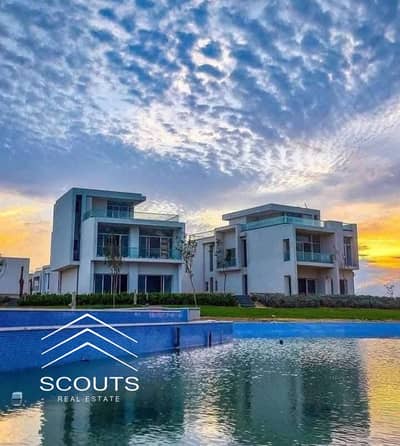 Chalet for sale, ground floor, 186 sqm, in installments, first row, overlooking the lagoon and the sea, next to El Alamein Towers, fully finished, in