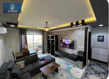 A furnished apartment is available for rent in Madinaty, super deluxe, in front of the East Hub.