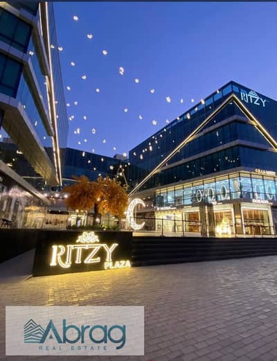 For sale, a 49 sqm shop, immediate receipt, leased with a return of 43 thousand, inside Ritzy Mall in Sheikh Zayed