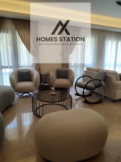 A Furnished Apartment with garden for rent in Eastown - New Cairo